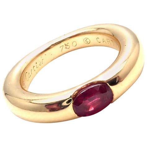 cartier 1992|18ct Gold & Ruby Ellipse Ruby Band Ring by Cartier.